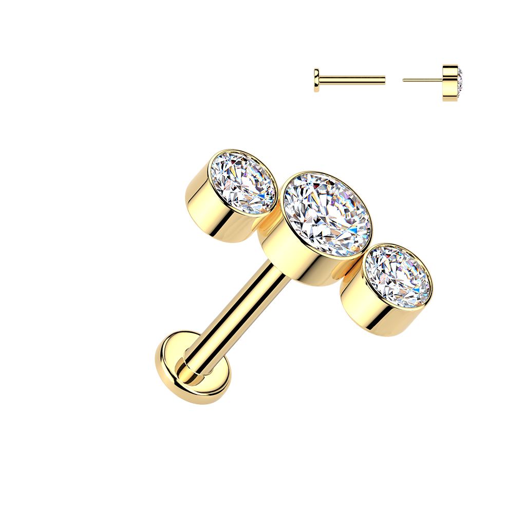 Gold titanium labret with three round bezel-set clear gemstones in a graduated row